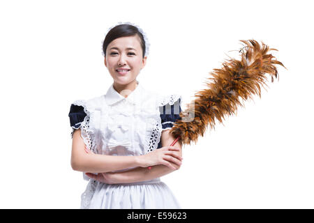 Happy maid with duster Stock Photo