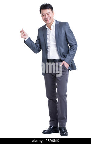 Mature businessman snapping his fingers Stock Photo