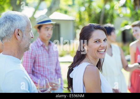 Woman laughing at party Stock Photo