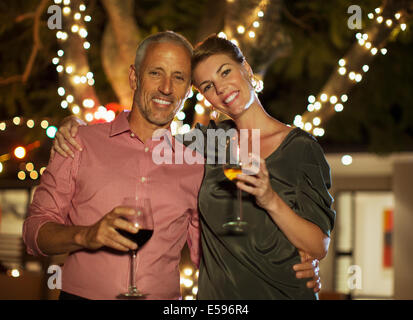 Couple drinking wine together outdoors Stock Photo