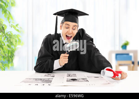 Graduate student seeking job in newspaper Stock Photo