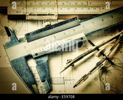 Old engineering tools on a technical drawing Stock Photo