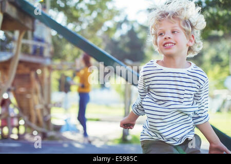 Boy playing on play ground Stock Photo