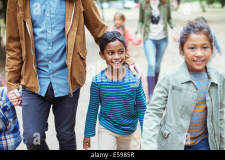 Students and teachers walking outdoors Stock Photo