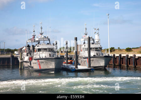 U. S. Coast Guard cutter ships on station along the barrier islands of the Outer Banks Stock Photo