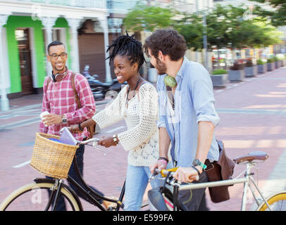 Friends walking together on city street