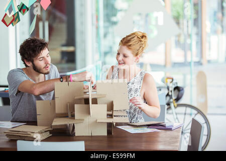 People building model together Stock Photo