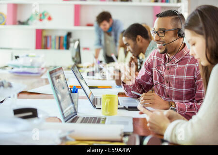 People working at conference table in office Stock Photo