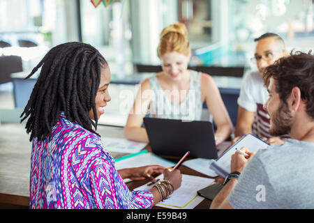 People working at conference table in office Stock Photo