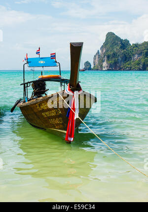 PHUKET, THAILAND - FEBRUARY 15, 2013: Traditional longtail boats in the famous Maya bay of Phi-phi Leh island, Thailand Stock Photo