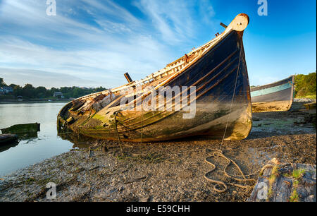An old wrecked wooden boat on the shore