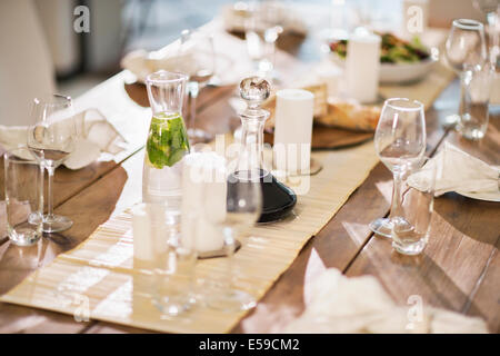 Set table at dinner party Stock Photo