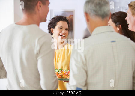 Woman laughing at party Stock Photo
