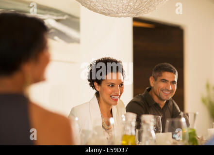 Friends talking at dinner party Stock Photo