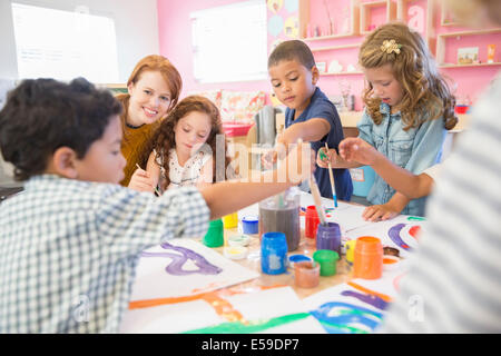 Students painting in class Stock Photo