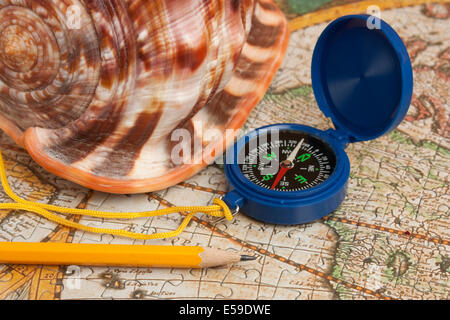 compass and seashell on the map Stock Photo