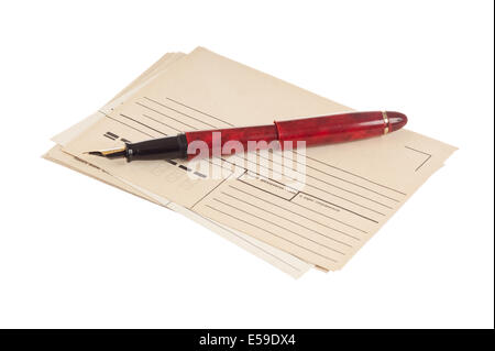 stack of mail envelopes and a pen isolated on white background Stock Photo