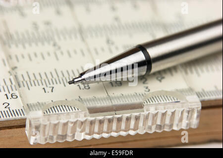 Vernier scale old logarithmic ruler and pencil Stock Photo