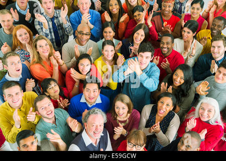 Portrait of clapping crowd Stock Photo