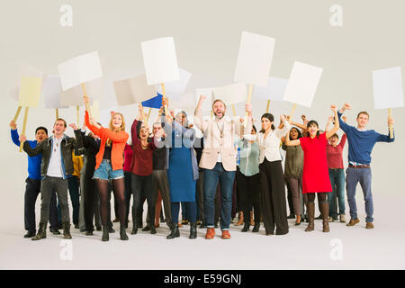 Diverse crowd with picket signs Stock Photo