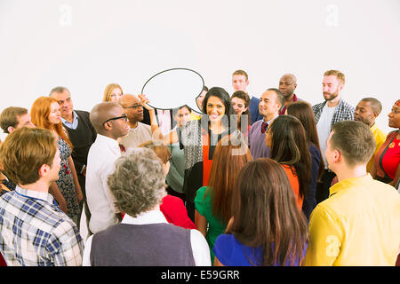 Businesswoman with speech bubble in crowd Stock Photo