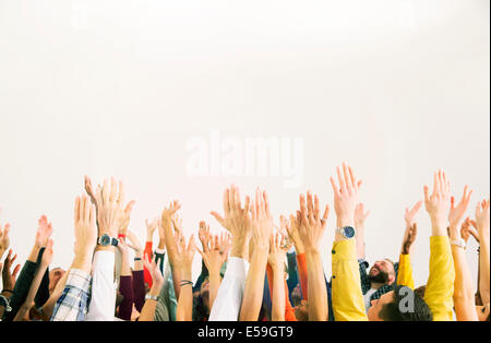 Business people with arms raised Stock Photo