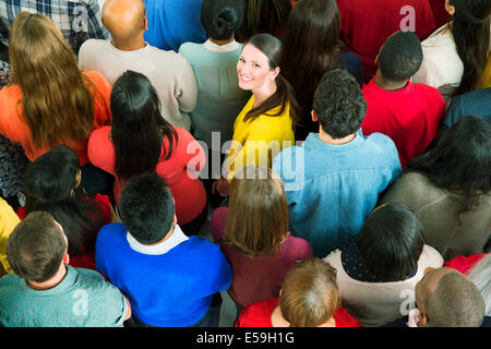 Portrait of confident businesswoman in crowd Stock Photo