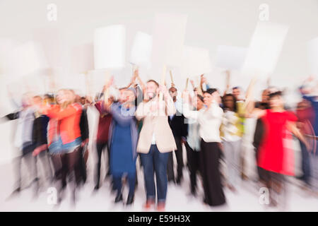 Protesters waving picket signs Stock Photo