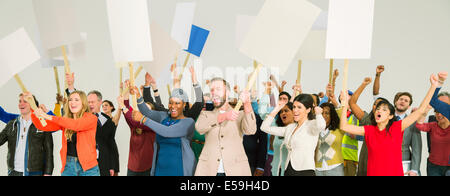 Protesters waving picket signs Stock Photo