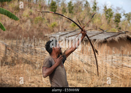 Tribal archer with Bow and arrow, Kamar tribe, Matal Village, Chattisgadh, India Stock Photo