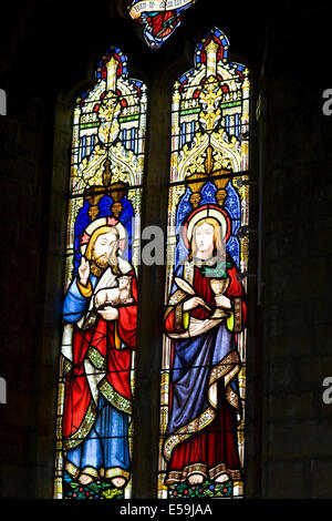 Narrow stained glass window in church of St Gregory in Tredington Warwickshire Stock Photo