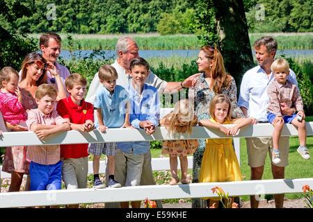 Grasten Palace, Denmark. 24th July, 2014. Members of the Danish Royal family, (L-R) Princess Marie with Princess Athena, Prince Christian, Prince Joachim, Prince Felix, Prince Henrik, Prince Nikolei, Prince Henrik, Princess Josephine, Crown Princess Mary, Princess Isabella, Crown Prince Joachim and Prince Vincent attend a photo session for the press at Grasten Palace, Denmark, 24 July 2014. Photo: Patrick van Katwijk NETHERLANDS AND FRANCE OUT - NO WIRE SERVICE -/dpa/Alamy Live News Stock Photo
