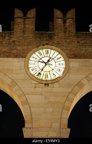 Clock on the Portoni della Bra medieval city gates, Corso Porta Nuova, Verona, Italy. Stock Photo