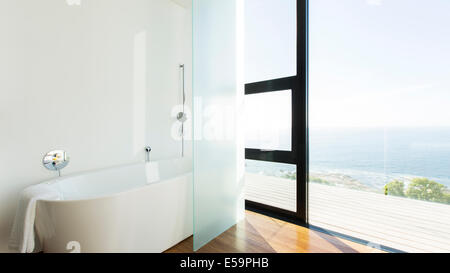 Bathtub and sliding glass door of modern house Stock Photo