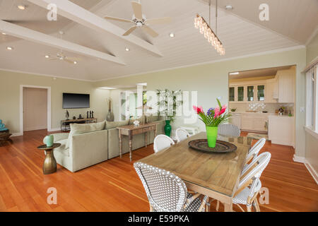 Living and dining room in beautiful home with wood floors Stock Photo