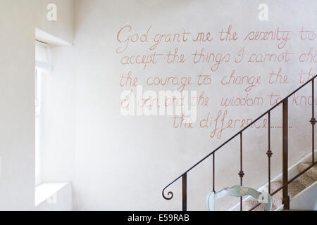 Quote on wall of rustic house Stock Photo