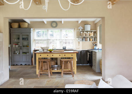 Island in kitchen of rustic house Stock Photo