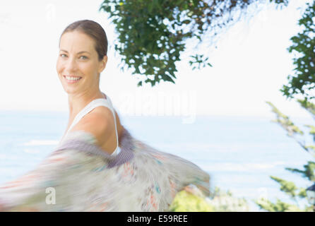Blurred view of woman spinning outdoors