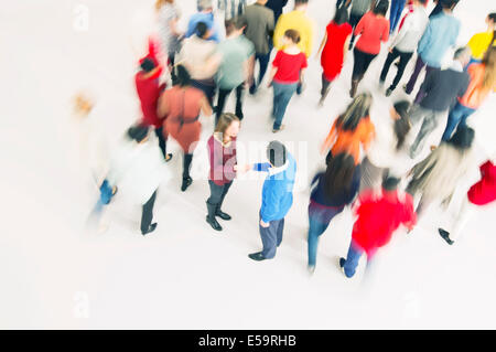 Business people handshaking in crowd Stock Photo