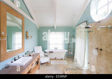 Bathtub and shower in rustic bathroom Stock Photo