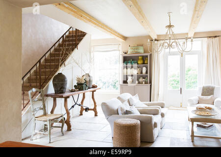 Sofas and staircase in modern living room Stock Photo