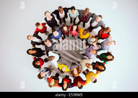 Portrait of confident business people in circle Stock Photo