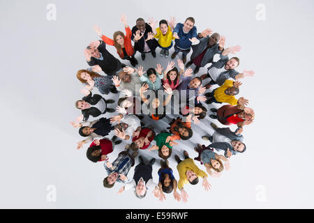 Portrait of enthusiastic business people in circle Stock Photo