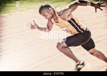 Sprinter racing on track Stock Photo