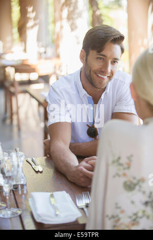 Couple talking in restaurant Stock Photo