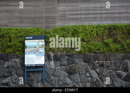 Wooden sign of a property for sale in Takapuna Beach, Auckland, New Zealand Stock Photo