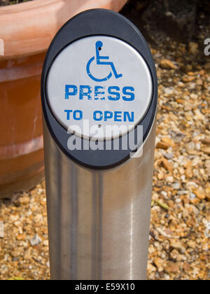 A disabled door access button on a post Stock Photo