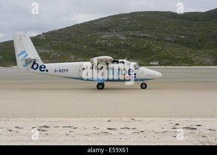 The scheduled flight from Glasgow lands at Barra Traigh Mhor beach airstrip in the Outer Hebrides, Scotland, UK, Europe Stock Photo