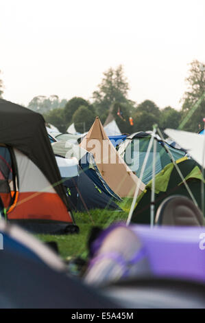 Charlton Park, UK. 25th July, 2014. Early morning of the first full day of the WOMAD festival has a few people up and moving about already. Temperatures  are hot and it isn’t even noon. Festival goers are hoping the predicted cooling of the weather for the weekend comes true. Credit:  Francesca Moore/Alamy Live News Stock Photo