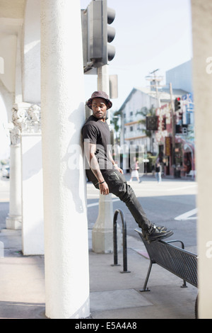 African American man standing on city street Stock Photo